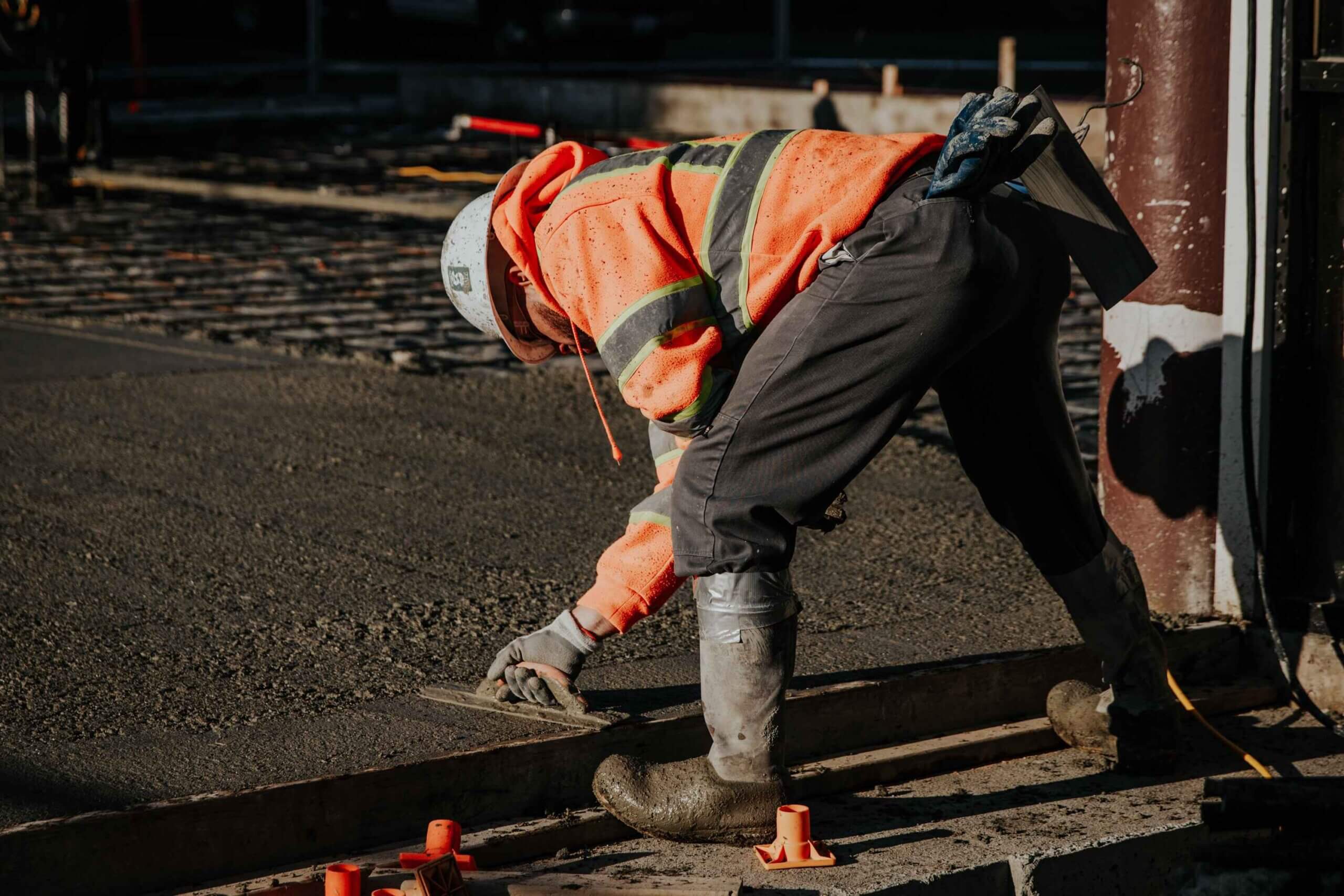 Construction crew working on a paved surface