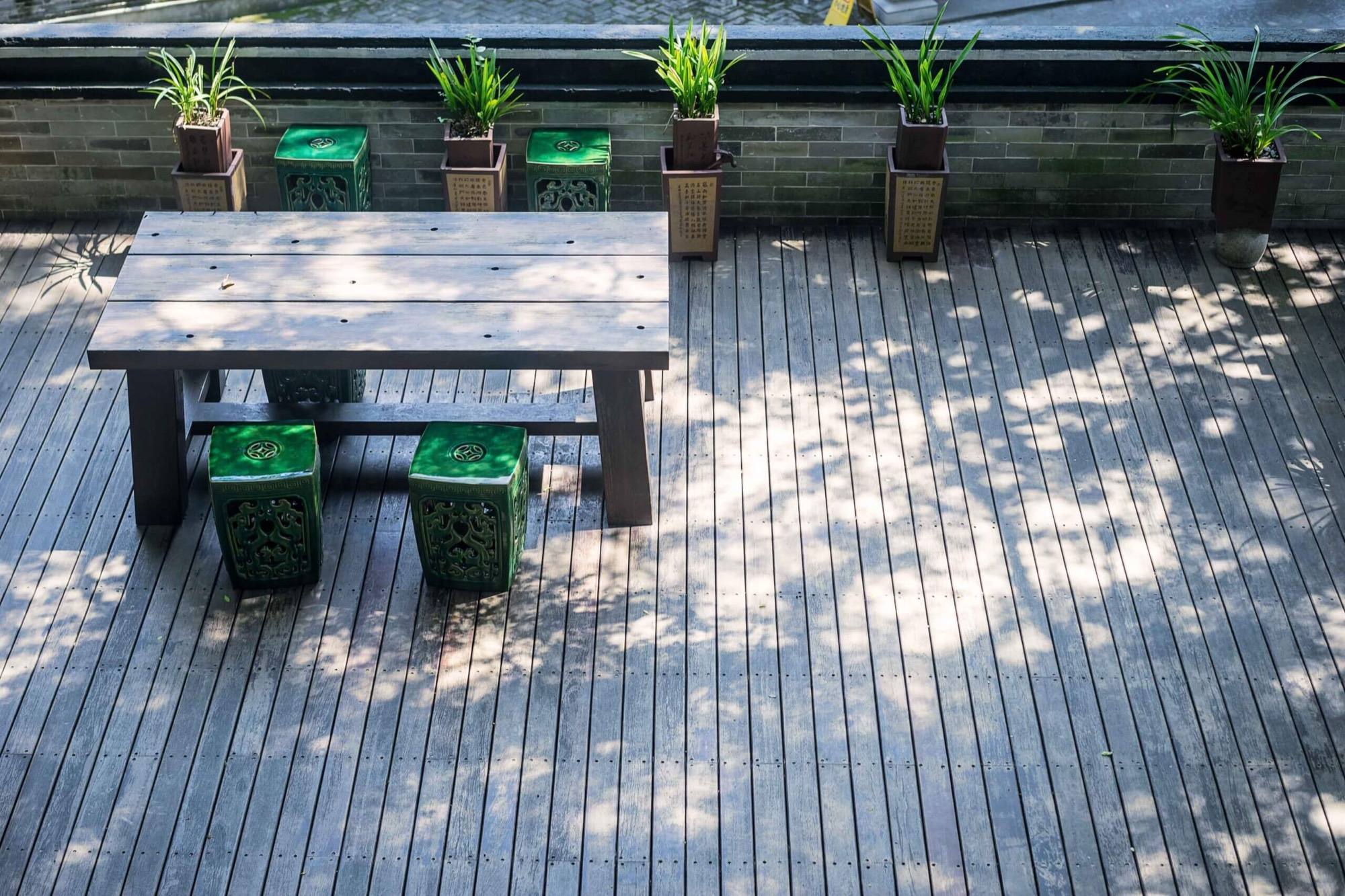 Deck terrace with a wooden table and plants