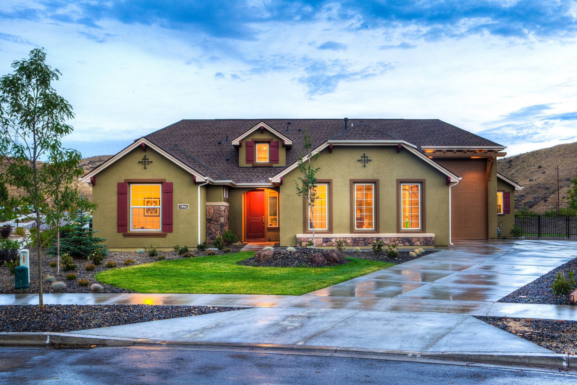 Home exterior with a sloped driveway