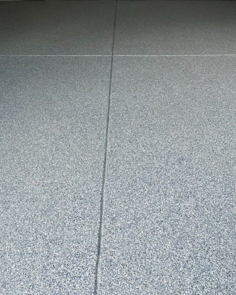 Gray and blue flake epoxy floor with clean control joints in Redondo Beach